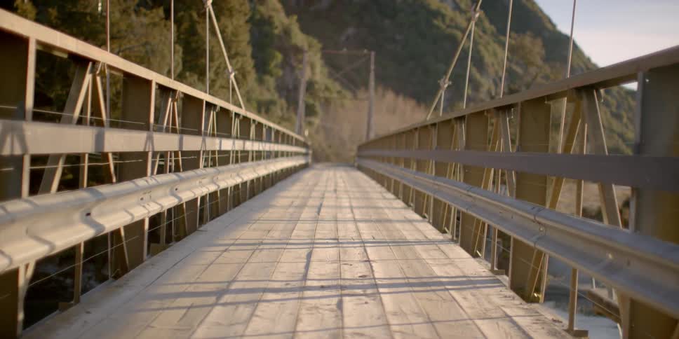 A rural bridge is shown on a sunny day