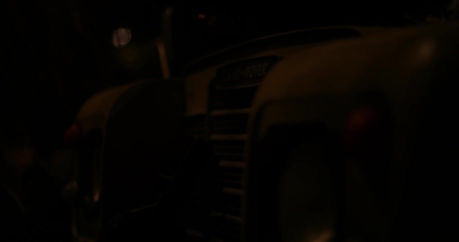 The car is sitting in a dark garage