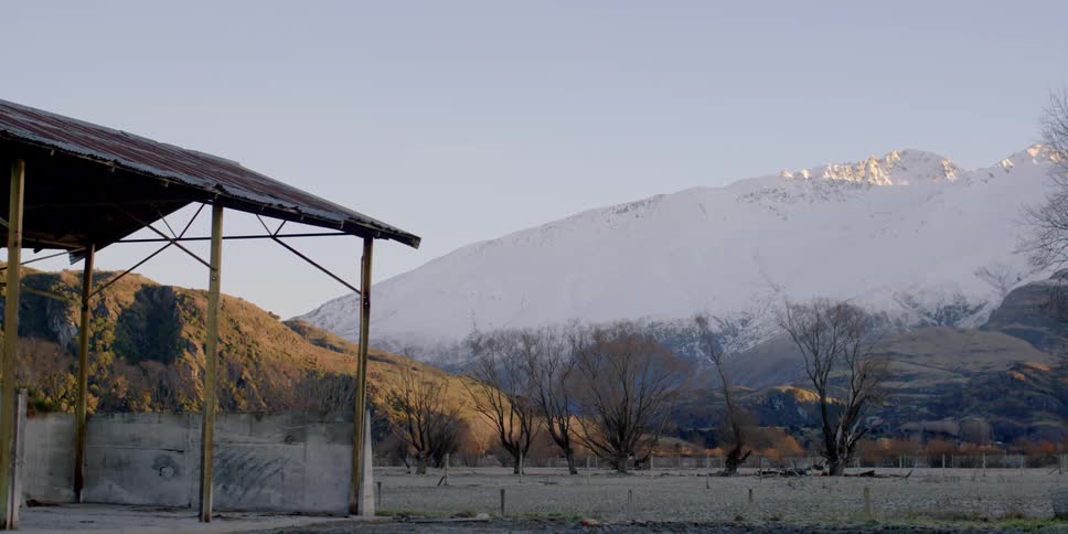 A snowy rural area is shown on a clear day