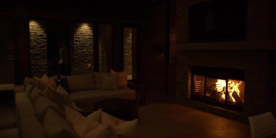A man walks past his lit chimney