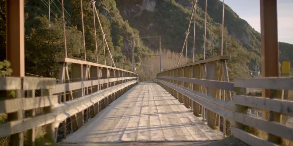 A rural bridge is shown on a sunny day