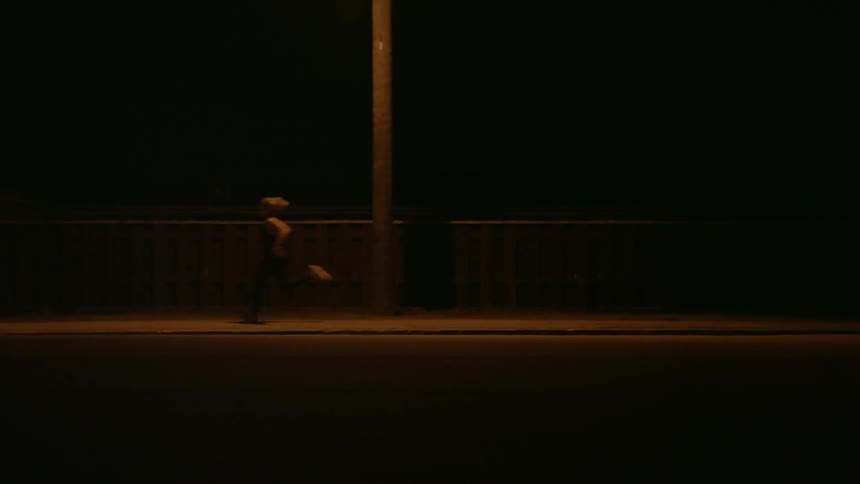 A woman runs fast down the street