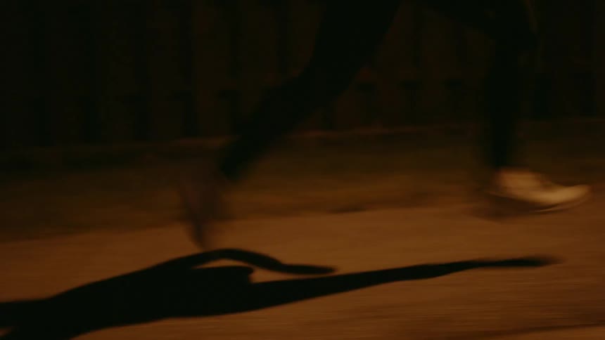 A person is running at night