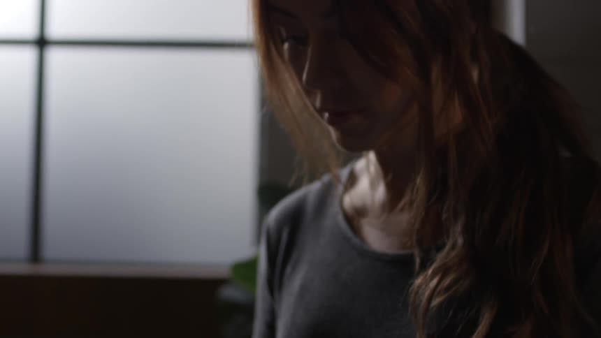 A woman is writing something
