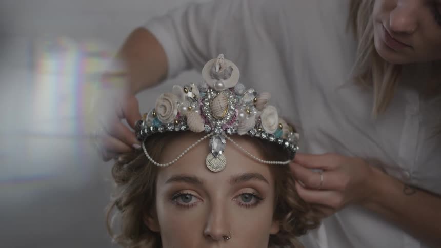 A woman has a crown put on her head