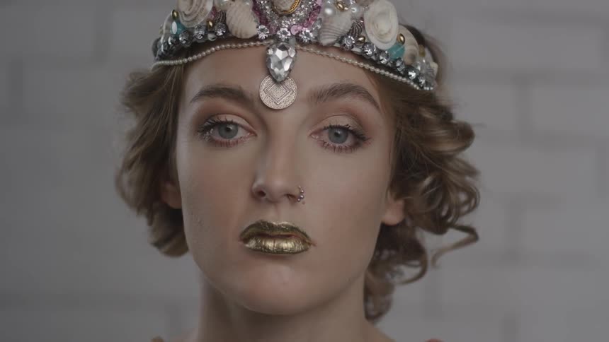 A woman is wearing a crown