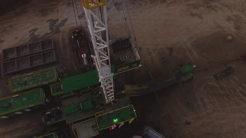 A work site has a tall metal tower
