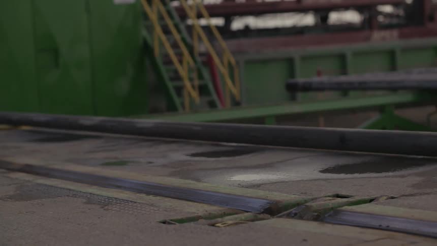 A pipe rolls on the ground