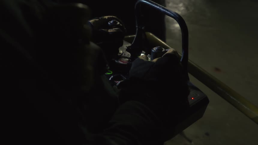 A man is operating a machine