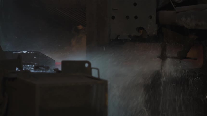 Liquid and smoke splashing out of a machine