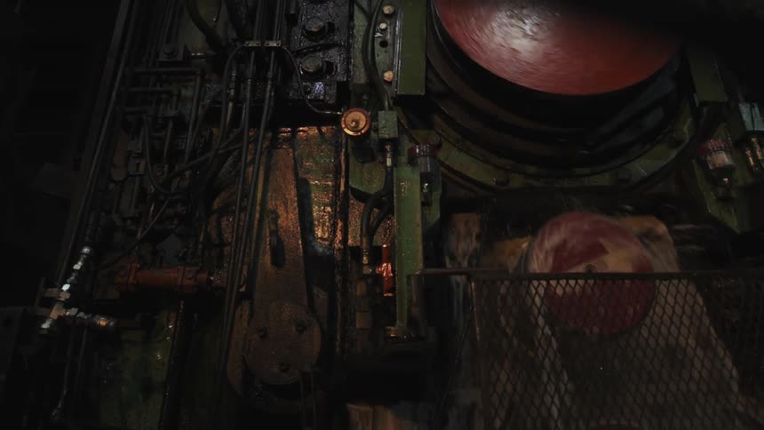 Wheels turn on this machine as water splashes around