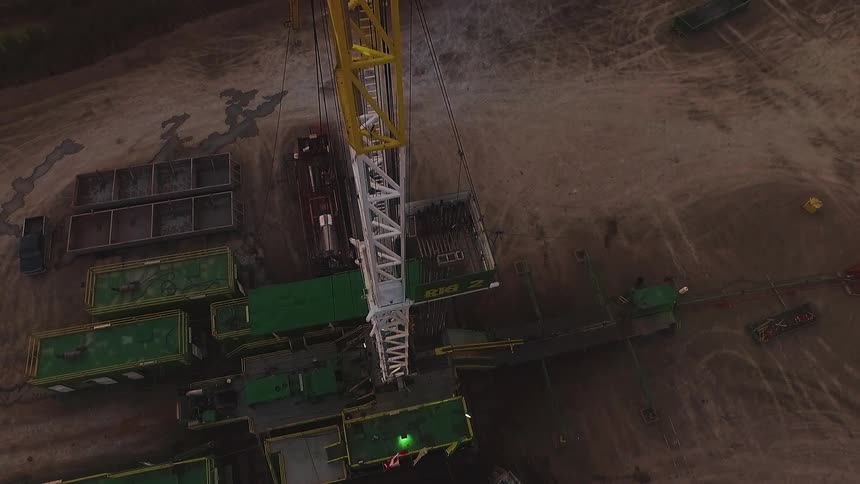 A work site has many containers on the ground