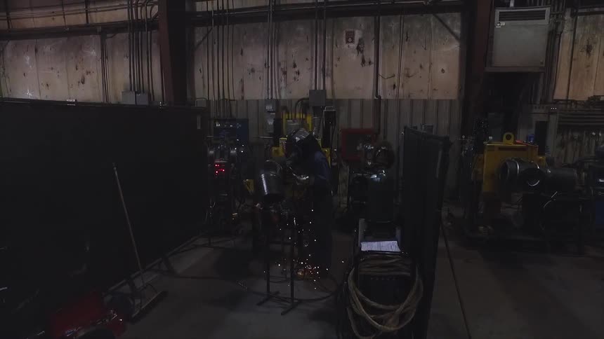 Person welds in a workshop