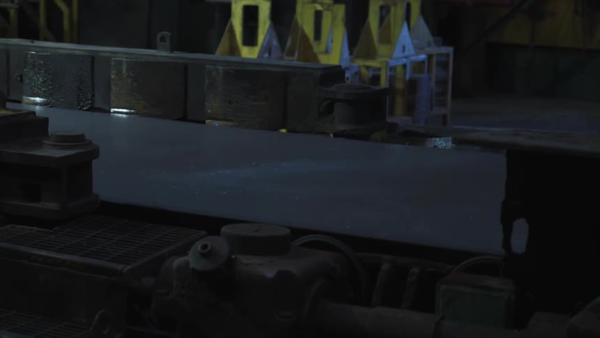 A conveyor belt moves out slowly