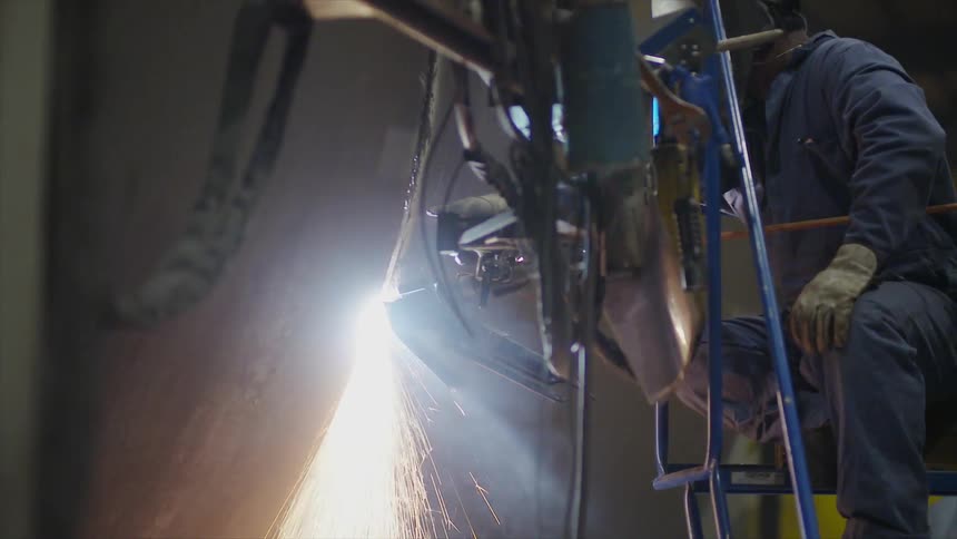 Person welds a large piece of metal