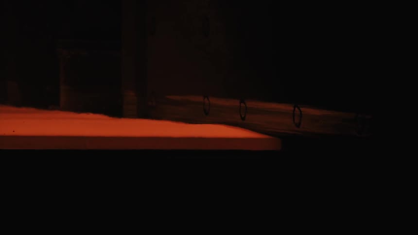 The sheet is red hot and rolling in the dark