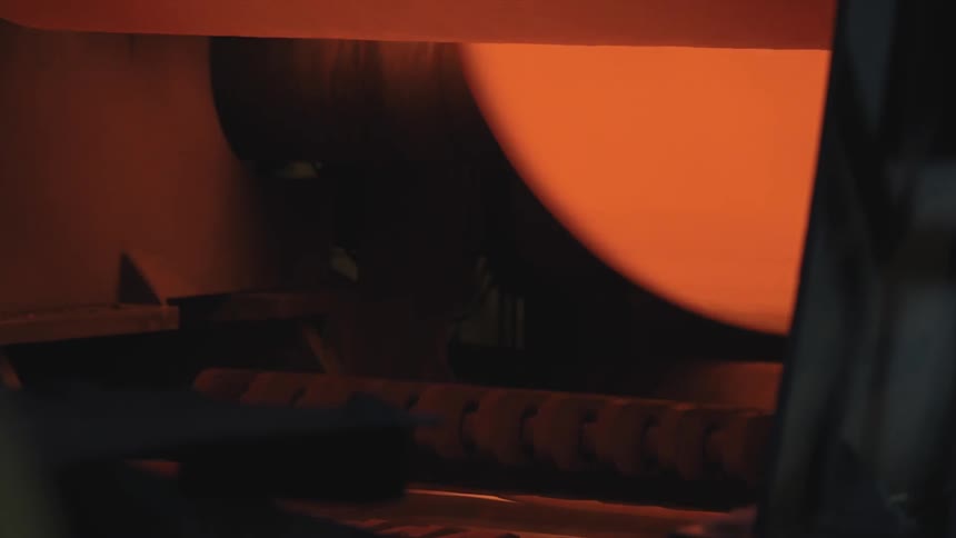 A piece of machinery functions in a factory setting