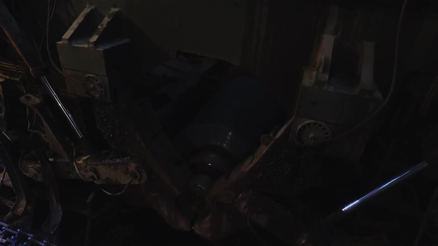 The parts of a machine are moving in the dark