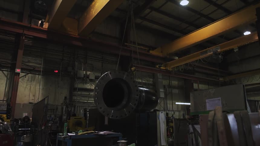 The shop has a pipe hanging from wire