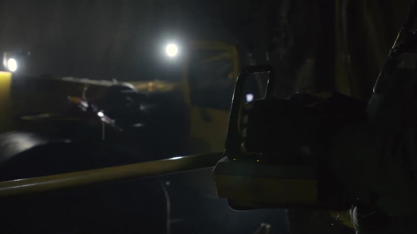 A bulldozer is driven at night