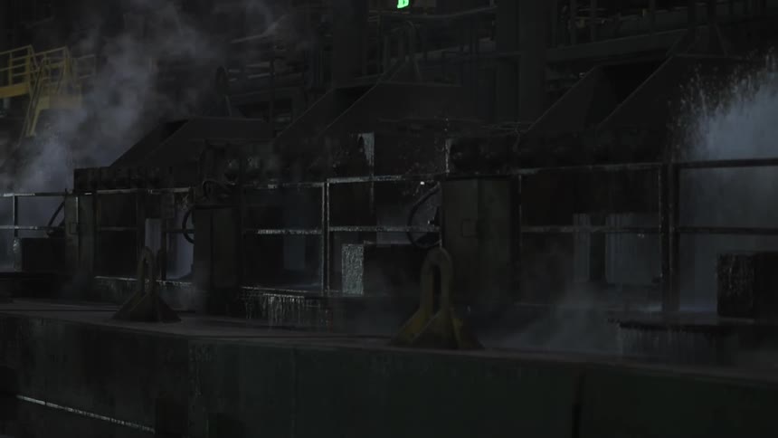 Smoke and water shooting up from machinery