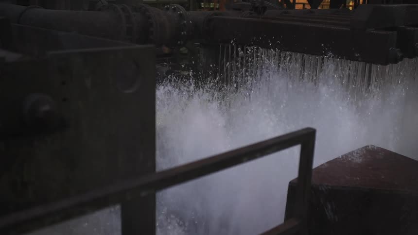 Machinery spilling water down in small streams