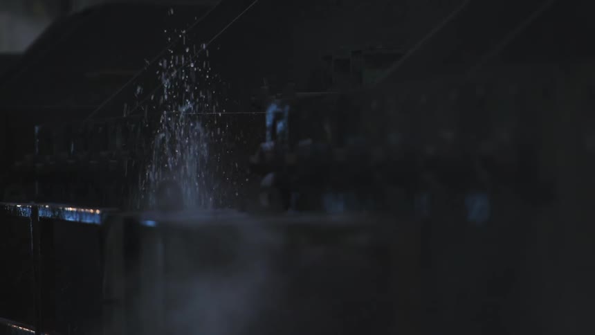 Water sprays up and all over by the machine