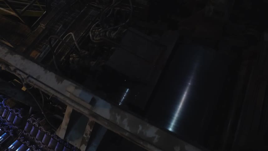 A cylinder rotates inside machinery