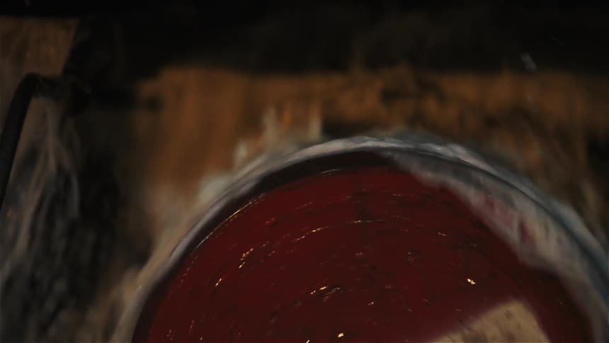 Water rushes over a turning barrel