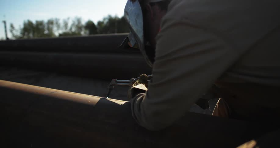 A man is welding outside