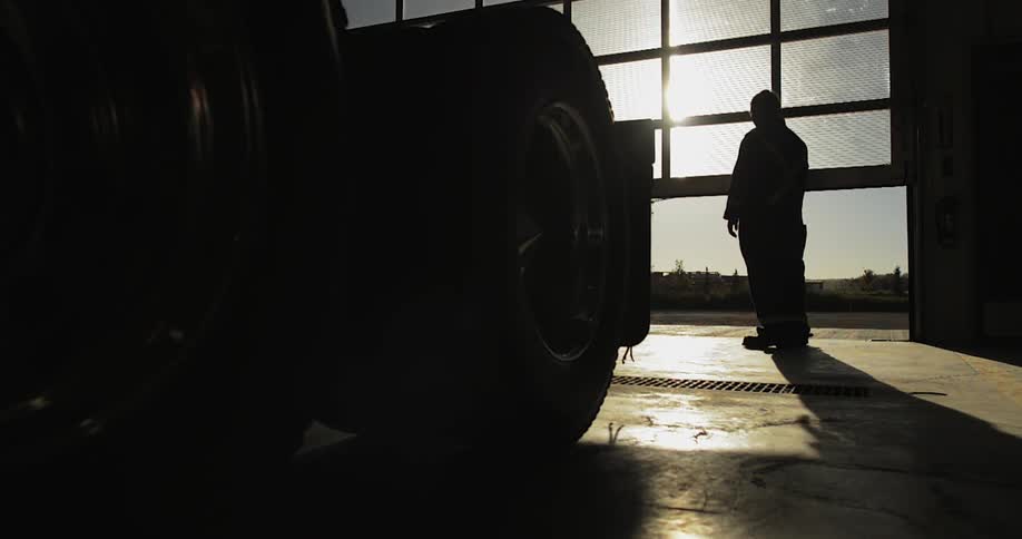 Man waits while a large door opens