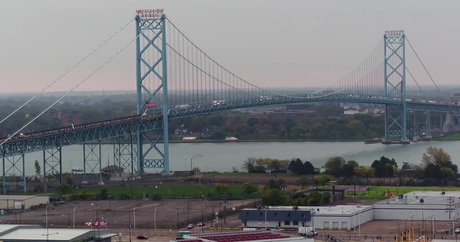 Cars travel over a bridge on a cloudy day