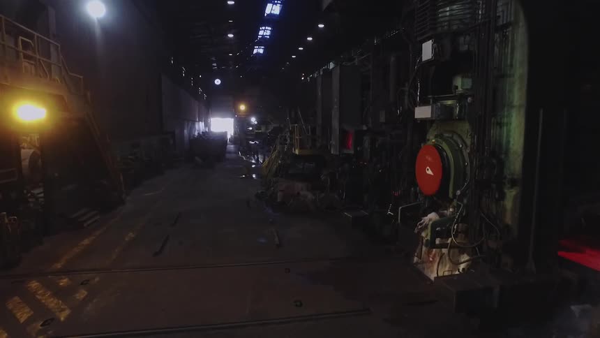 The long warehouse has many machines working together
