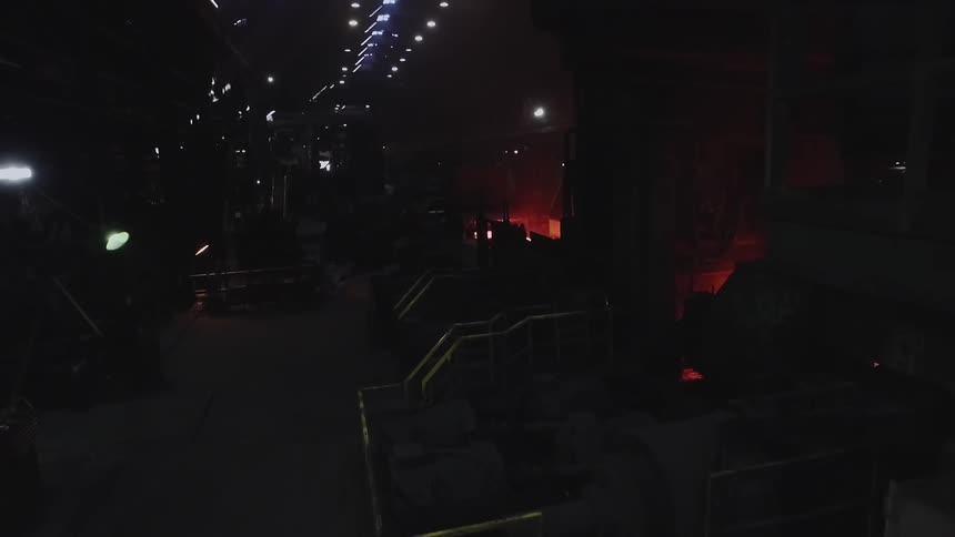 A factory is shown at night