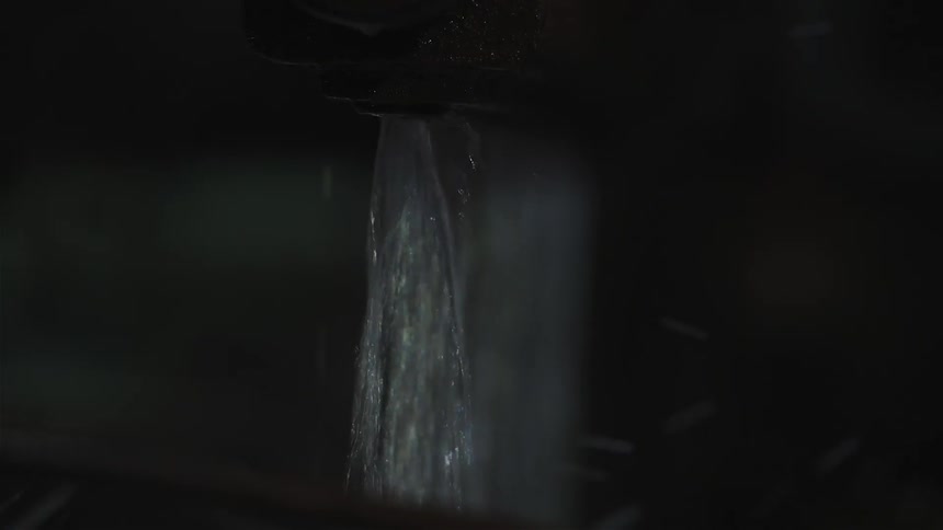 Water pours from a faucet
