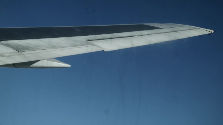 Airplane wing in the sky