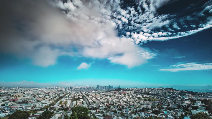 The clouds move fast over the city