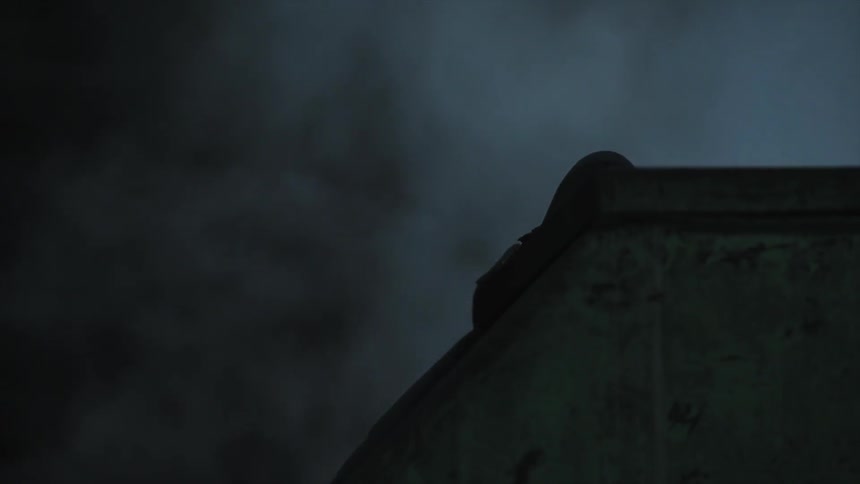 Smoke rising from a building at night