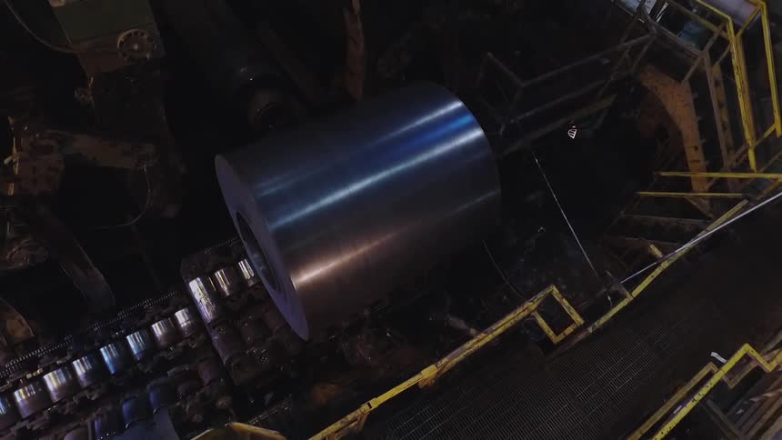 Large metal tube turns around in a factory