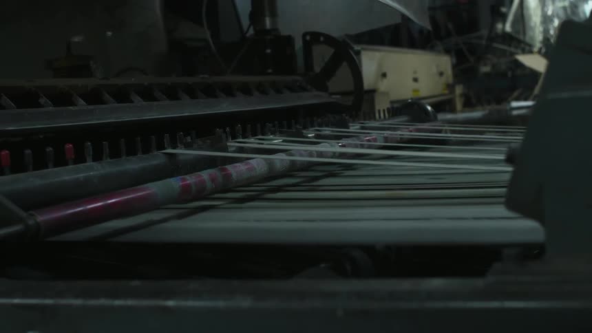 A machine is moving fast with thread running