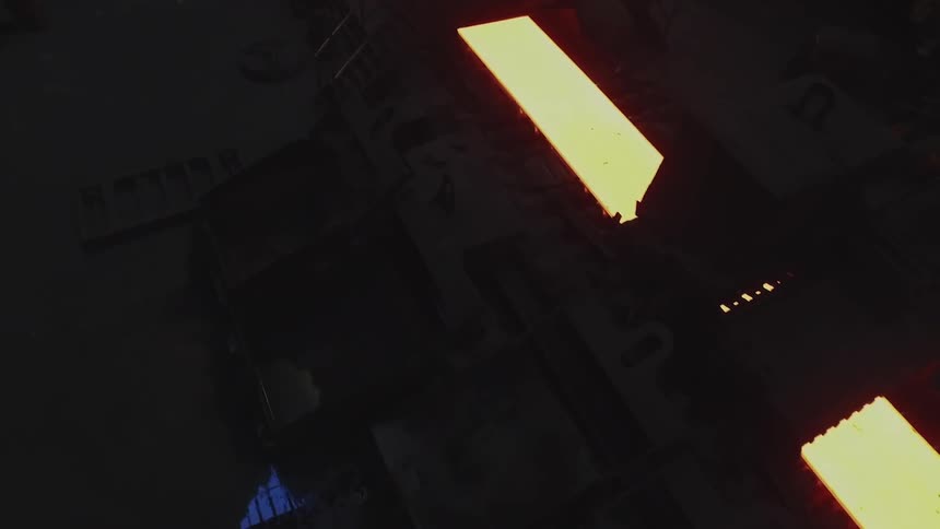 Molten looking sheet rolling on a conveyor belt
