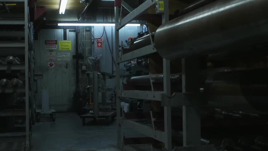 Shelving and equipment in a dimly lit factory