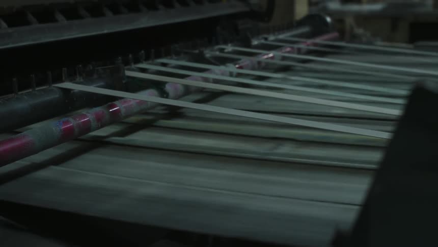 The belts in a machine are turning