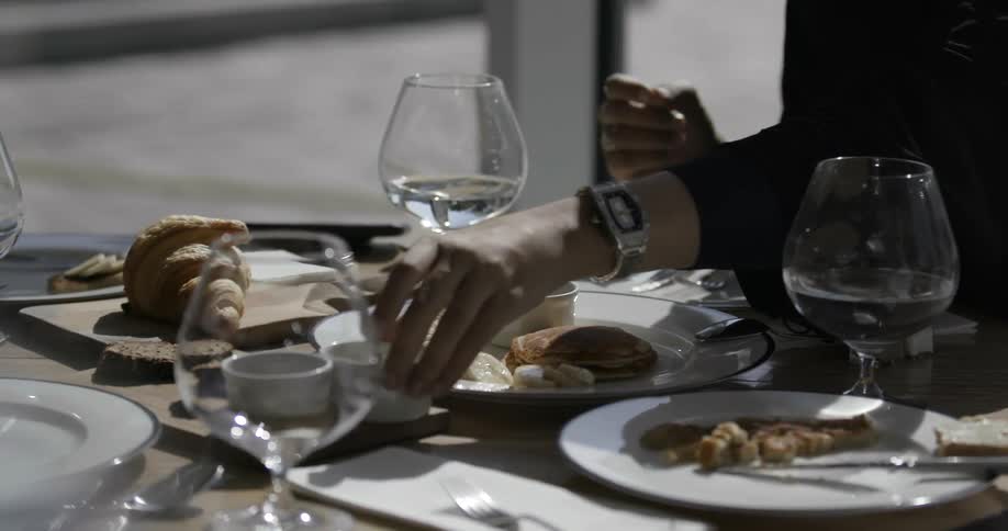 A person begins a meal outside