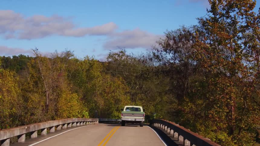 A truck drives around the road