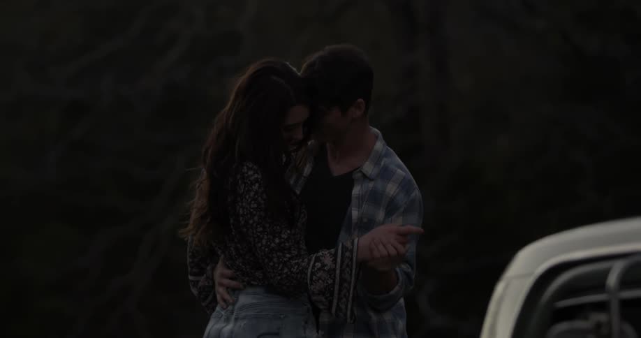 A man and woman dance at dawn