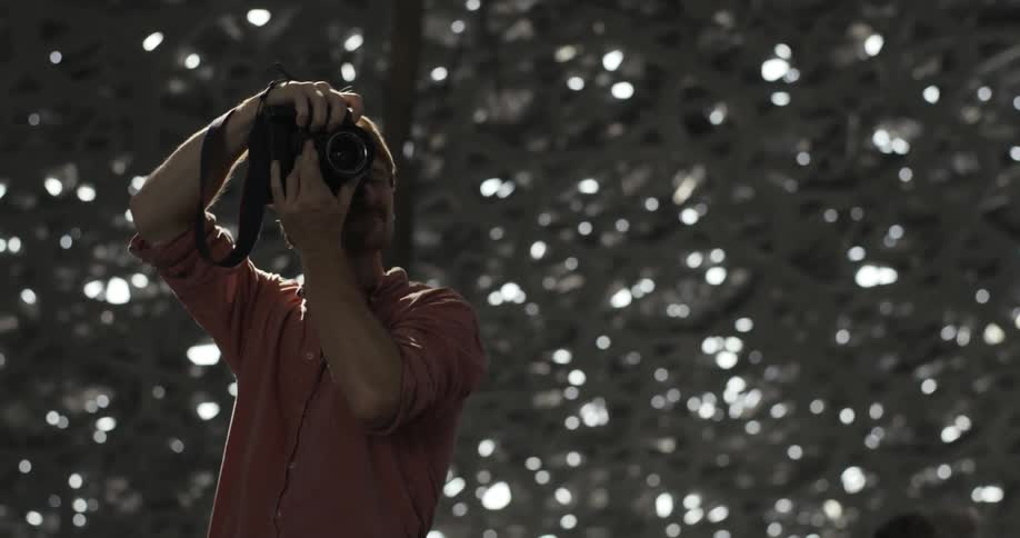 A photographer takes a picture outside