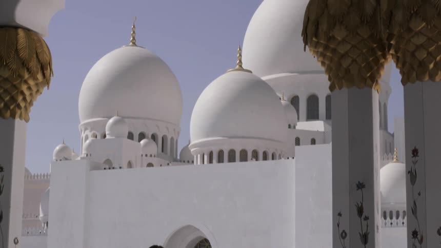 Man takes pictures of a large temple
