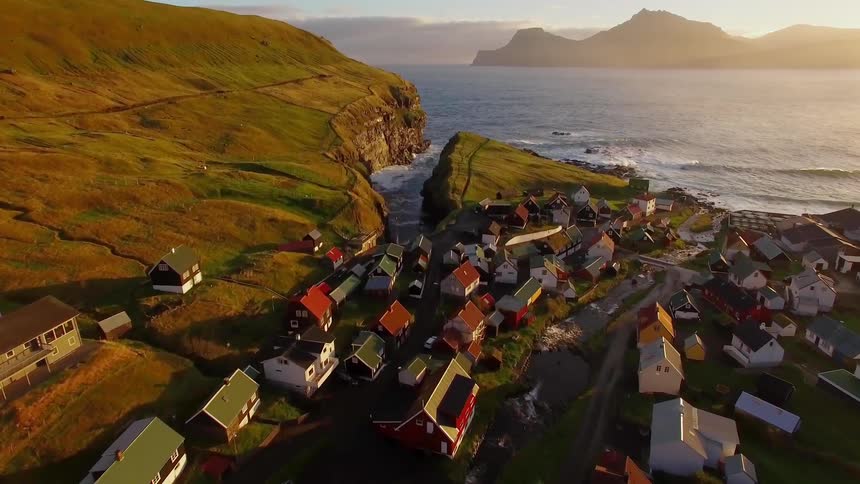 A small town is by the shore on a sunny day