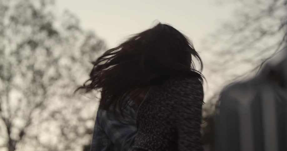 Man and woman dance outside in the woods